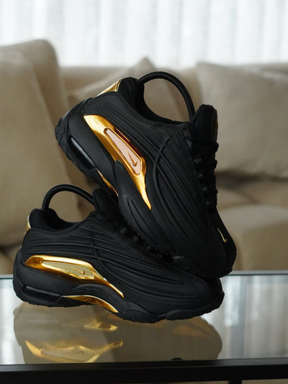NIKE NOCTA STEP 2 NEGRO DORADO