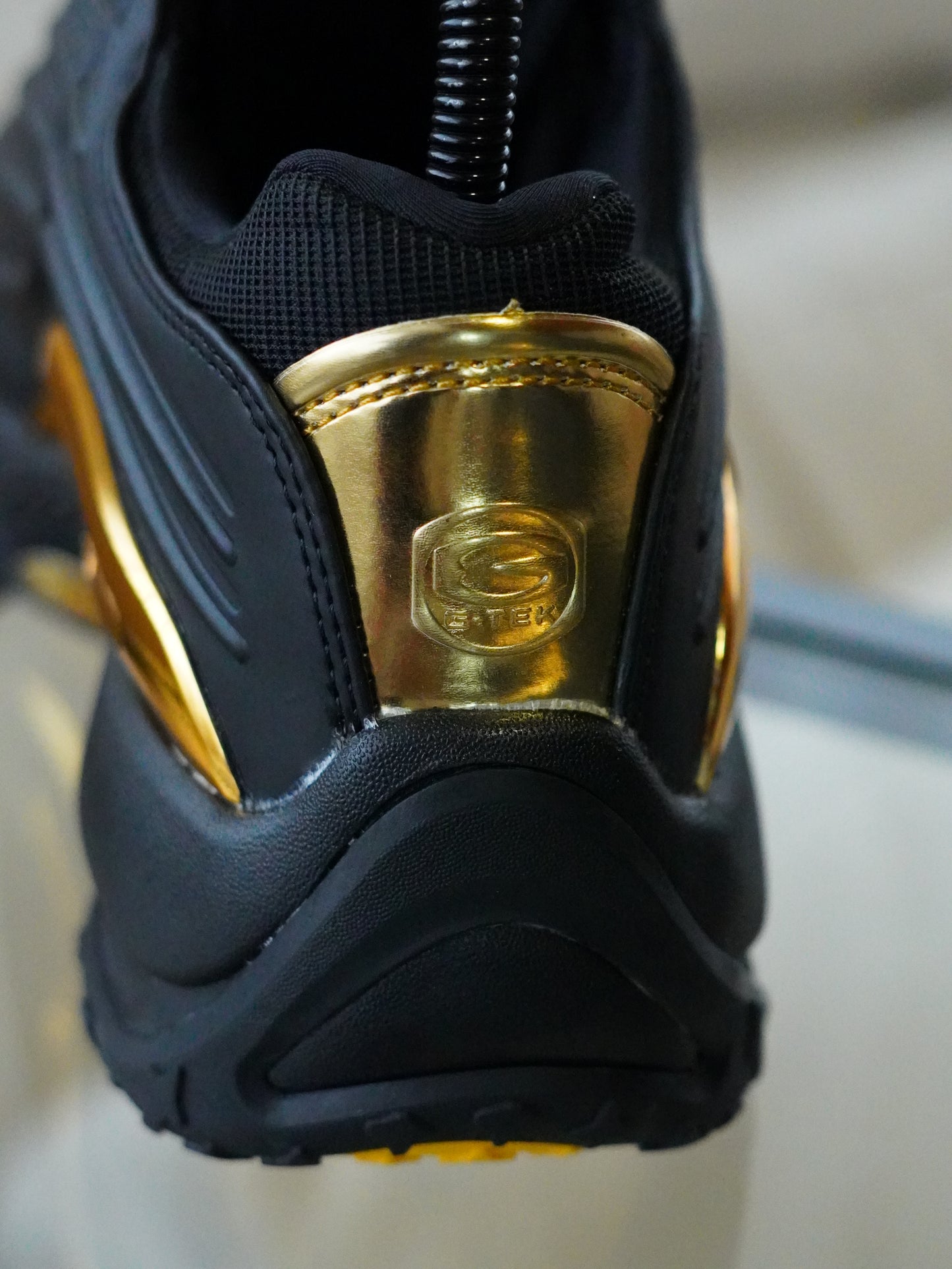 NIKE NOCTA STEP 2 NEGRO DORADO