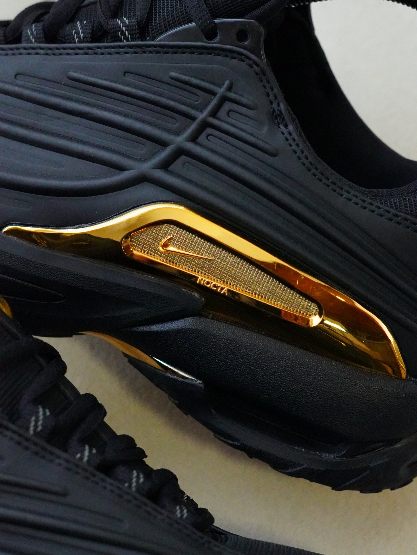 NIKE NOCTA STEP 2 NEGRO DORADO