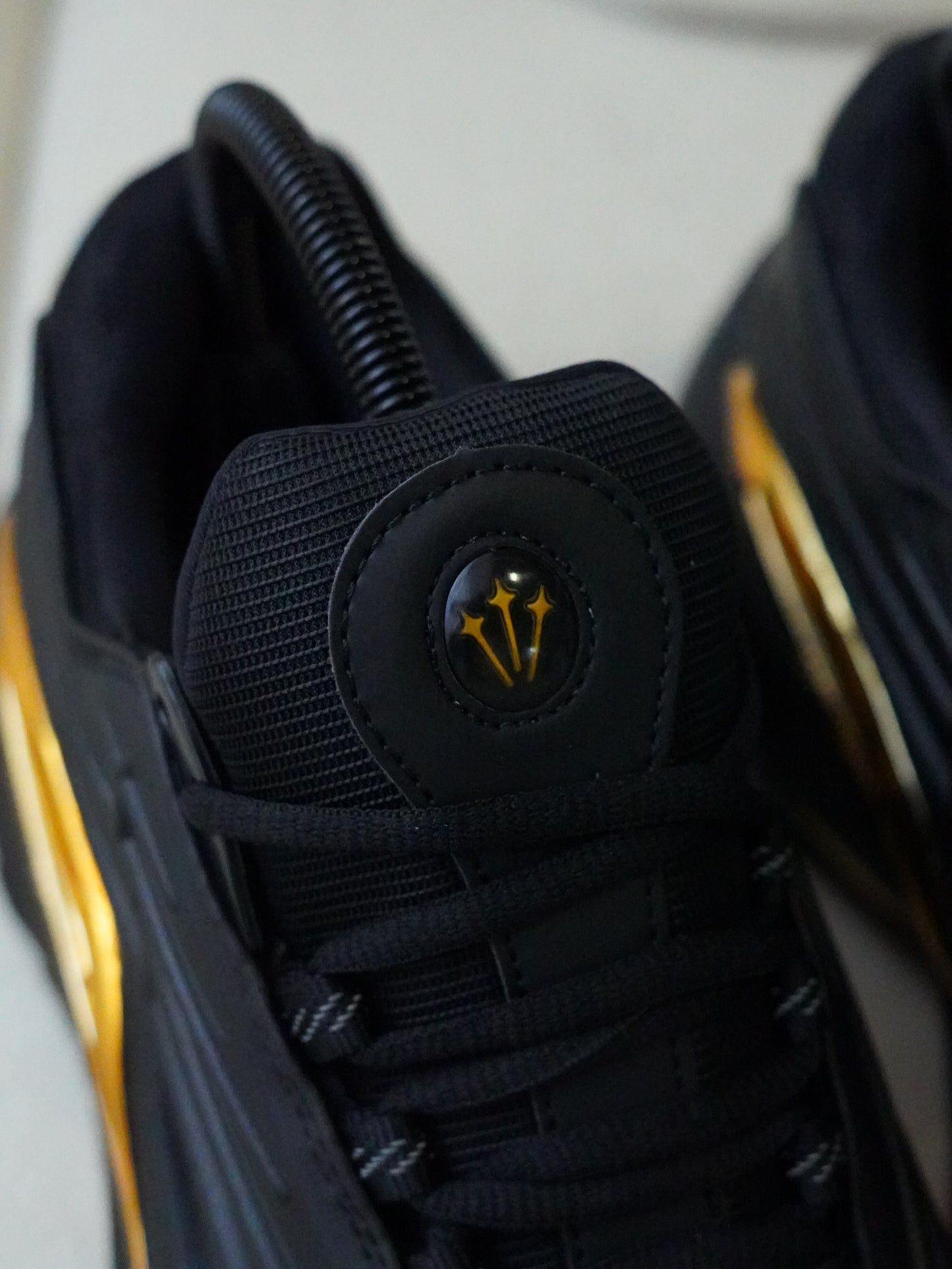 NIKE NOCTA STEP 2 NEGRO DORADO