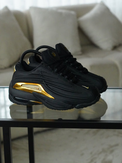 NIKE NOCTA STEP 2 NEGRO DORADO